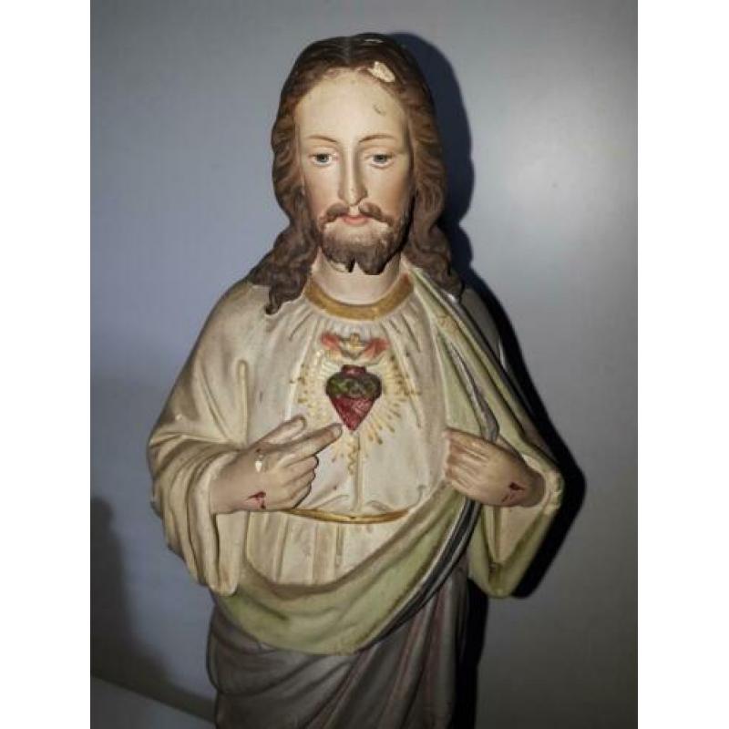 Beeld Jezus onder stolp