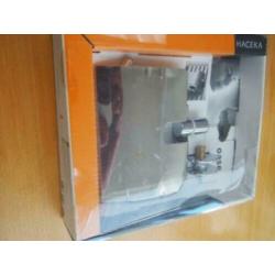 064 Haceka Adoria Oase, closetrolhouder radiatorbevestiging