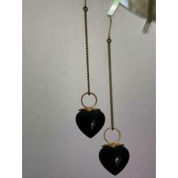 Double oorbellen met onyx hartje