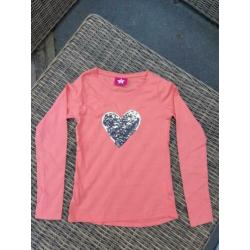 Longsleeve oranje met pailletten mt 128/134