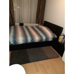 Bed met opbergruimte